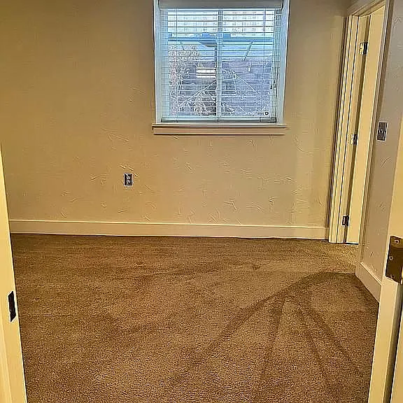 Primary bedroom, large egress window.