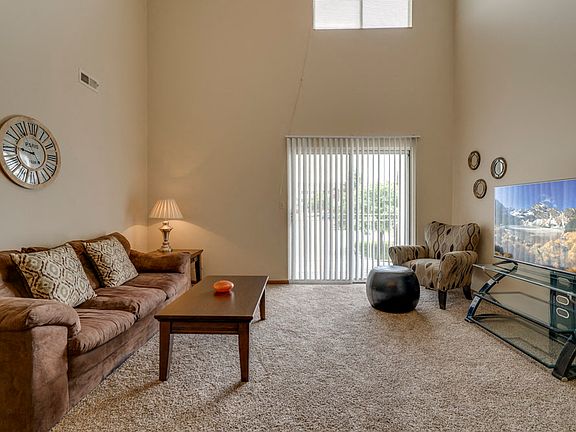 The living rooms in our loft-style homes feature soaring ceilings and natural light from large windows.