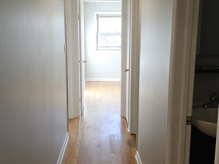 Hallway to bathrooms & Bedrooms from kitchen and living room