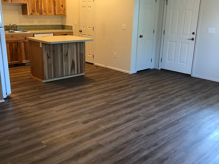 View of family room with open floor plan to kitchen
