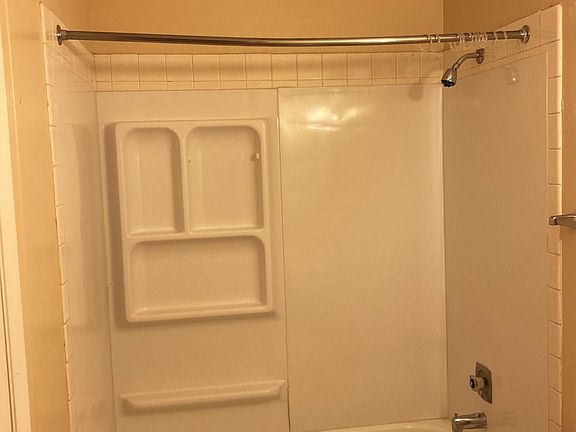 Lovely bathroom with huge walk-in closet, vanity, mirror and lighting!
