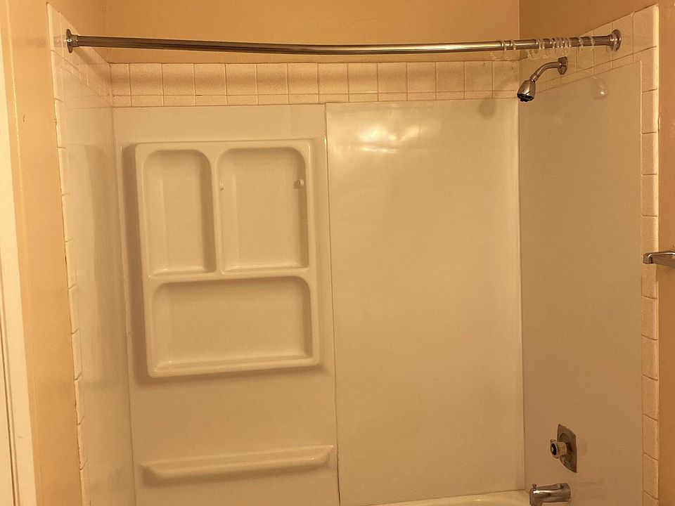Lovely bathroom with huge walk-in closet, vanity, mirror and lighting!