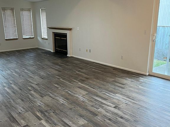 Dining area with sliders to side yard.
