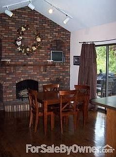 Eat-In Kitchen
						:
						Black Mortor brick fire place in the kitchen with vaulted ceilings.