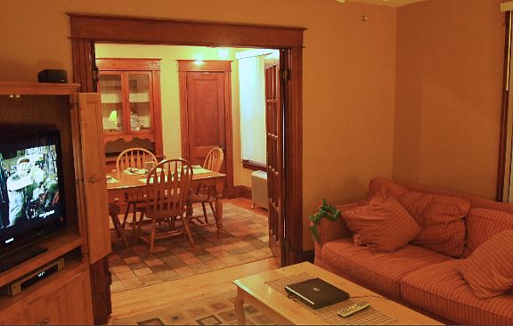 Living Room looking into the Dining Room. Can be used as Bed