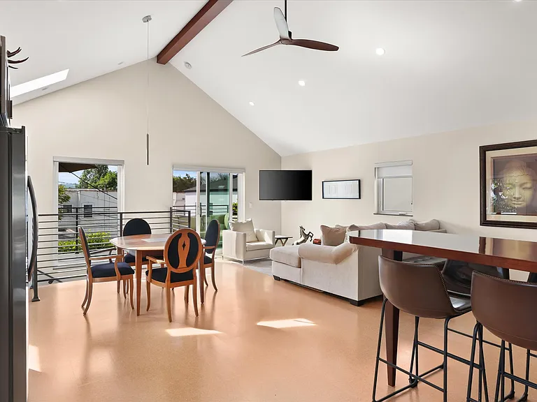 Bright living space with large windows and elevated views.