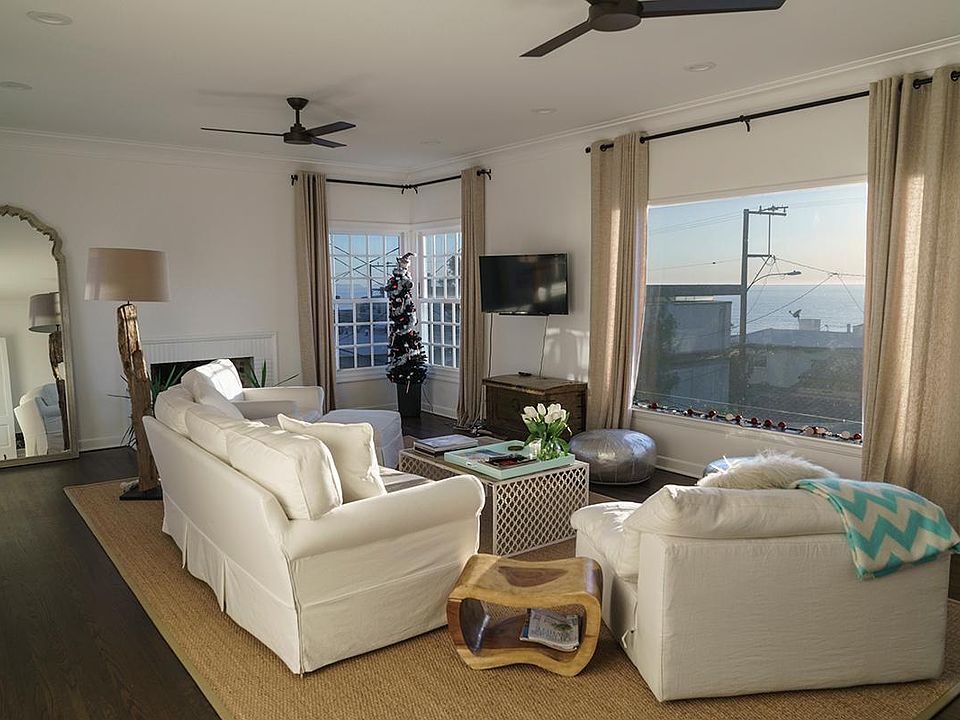 The living room is 17 by 25 feet with a view of the Pacific 