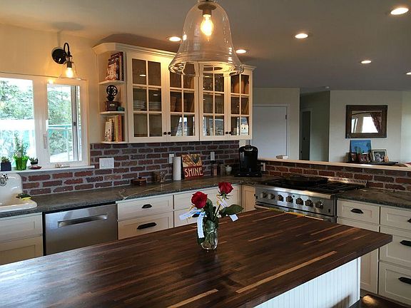 Fully updated kitchen with top of the line appliances including Bosch quiet dishwasher and Wolf range and oven