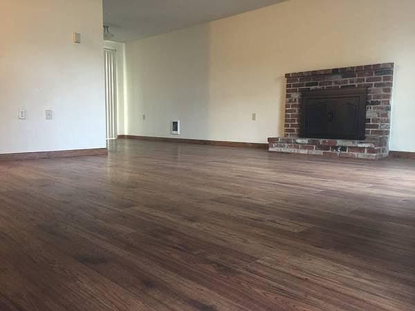 Living room with wood burning fireplace