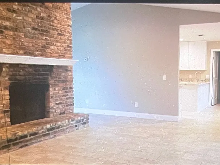 Large Family Room with vaulted ceilings: working fireplace: opens to kitchen & extra "bonus room"