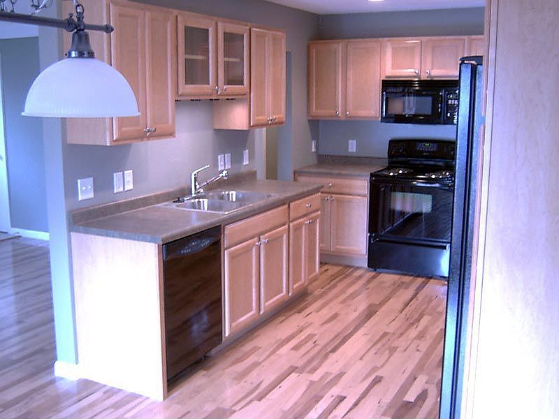 New maple cabinets and hickory hardwood flooring