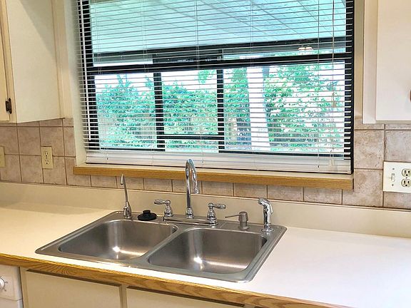 Kitchen sink overlook to backyard 