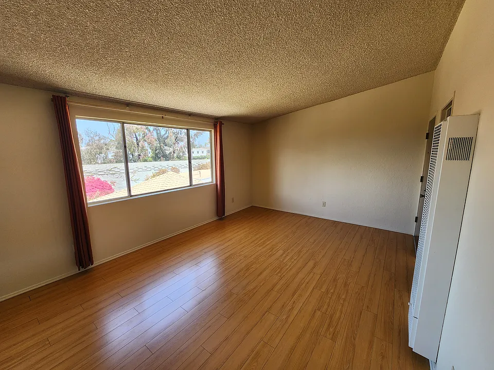 Living room is bright. High Ceiling