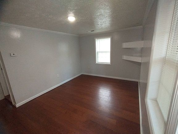 Living Room with built in shelves/TV mount