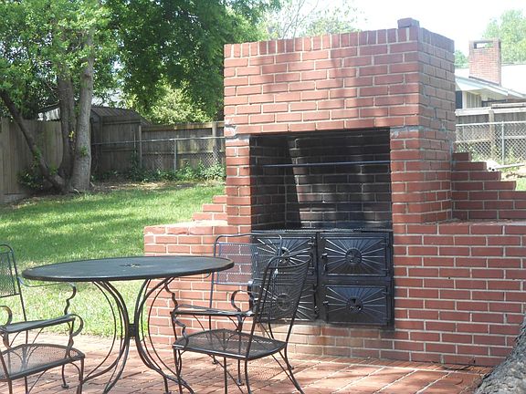 Outdoor patio with fireplace