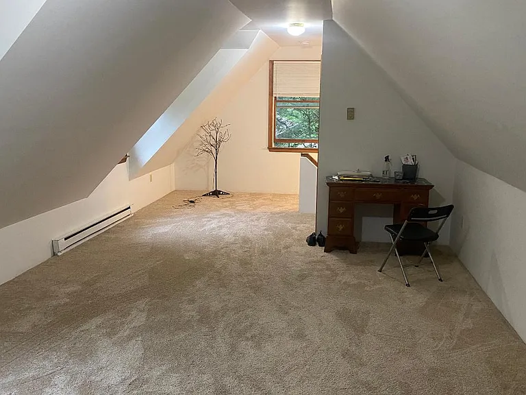 30 foor long bedroom with new carpet and paint!