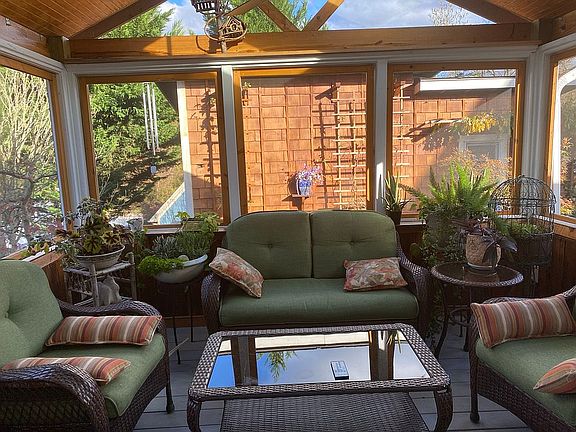 Screened in sun porch by day