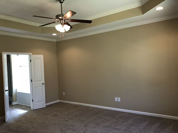 File photo of the owner s suite with tray ceiling.
