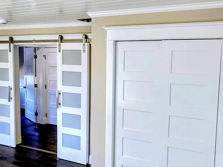 Bedroom with barn doors & closet