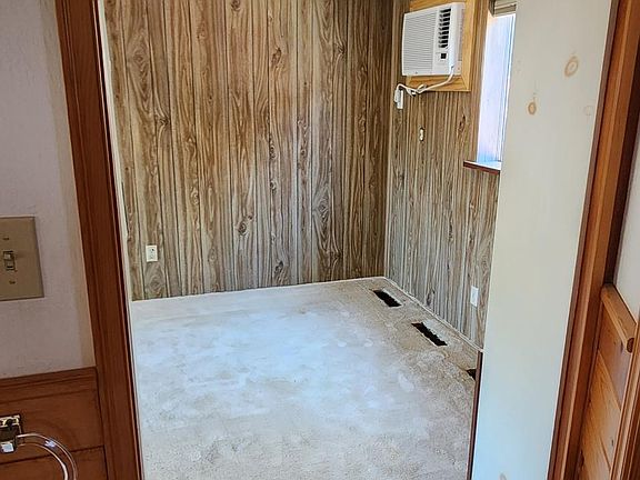 View from kitchenette/bathroom area to den. There is a pockeet door that separates the 2.