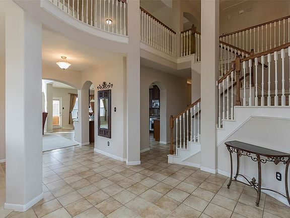 Enter the home into the large inviting two-story foyer