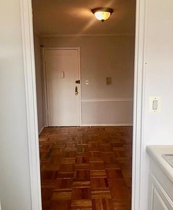 VIEW FROM KITCHEN TO THE ENTRYWAY/ FOYER