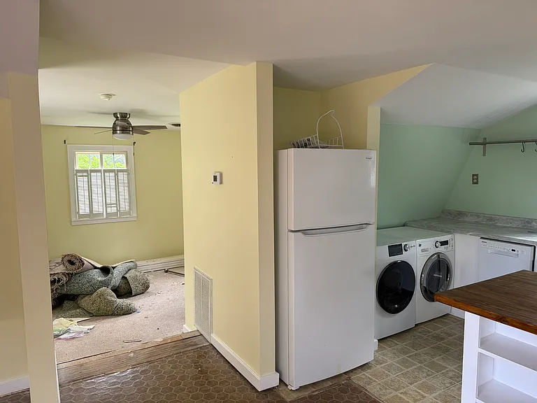 Main room looking left towards bathroom. Old carpet not included. New carpet pending.