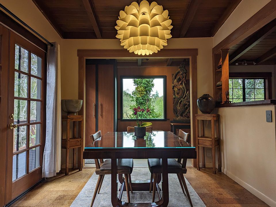 Dining room with big picture window and French doors to huge deck.