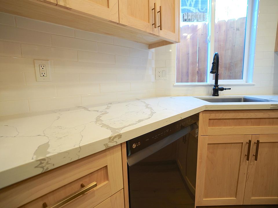 Custom wood cabinets, quartz countertops, slow close doors/drawers.