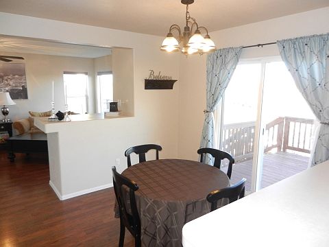 Spacious eatin kitchen w SS appliances w walkout to deck