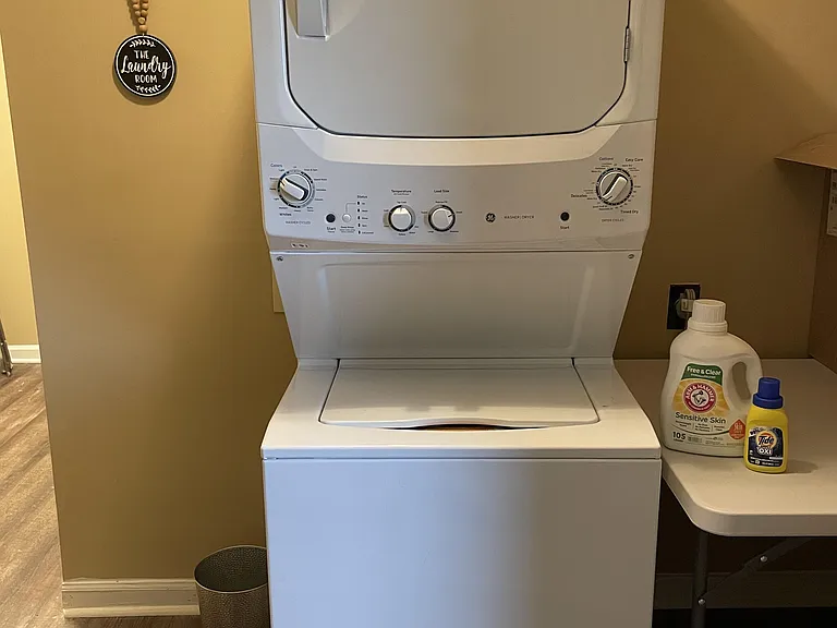 The Laundry area where all House Guests take turns using the brand new Washer & Dryer along with a Sorting / Folding Station