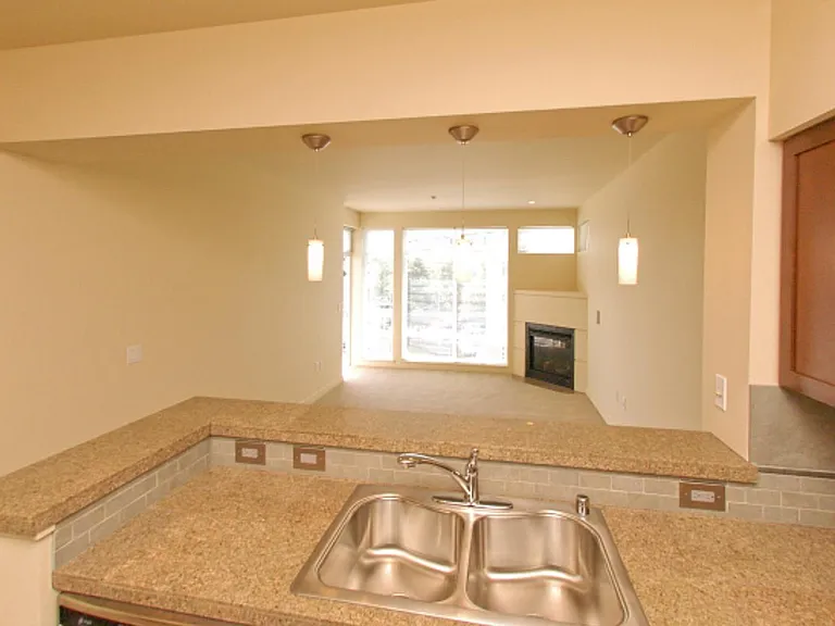 Kitchen looking into living room