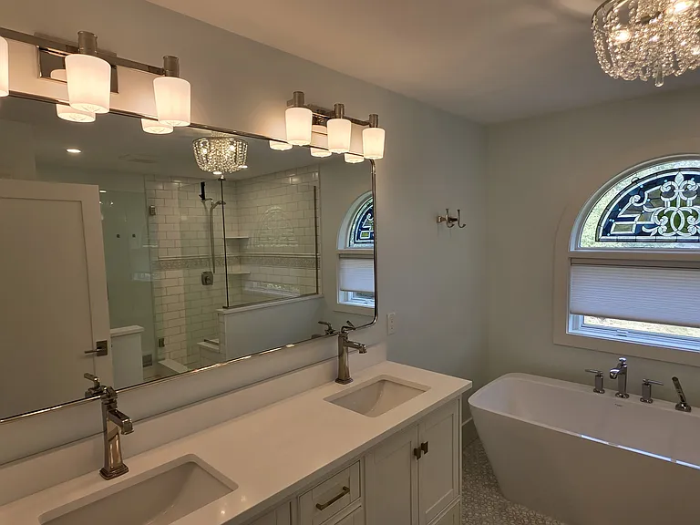 Primary bathroom with double sink and roman tub.