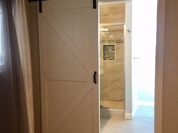 Bathroom with stylish barn door