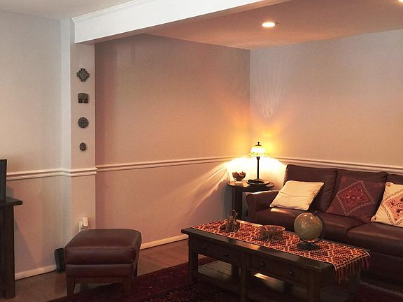 Living room with hardwood floors and recessed lighting