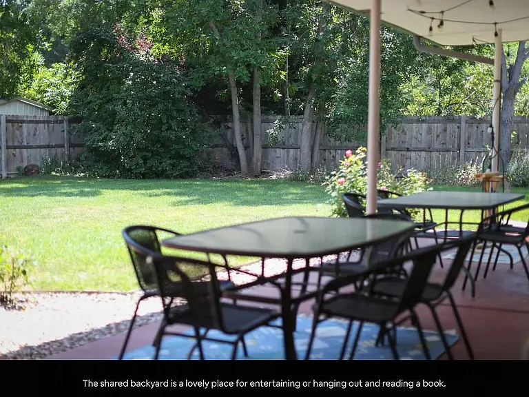 Backyard tables for outdoor eating, working, entertaining. There is also a large gas grill in the backyard to use.