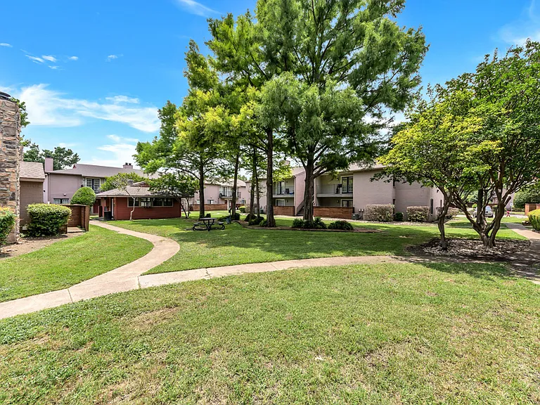 Well-maintained walking paths and lush landscaping throughout the community.