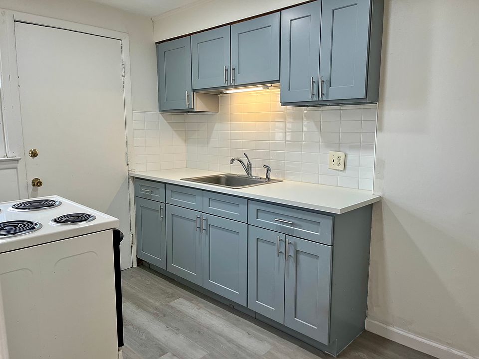 Newly renovated kitchen with maple cabinetry and brand new refridgerator.