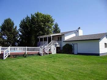 House is beyond the tree