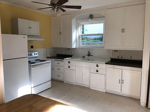 Large, bright country kitchen with breakfast bar/pass through to living room.