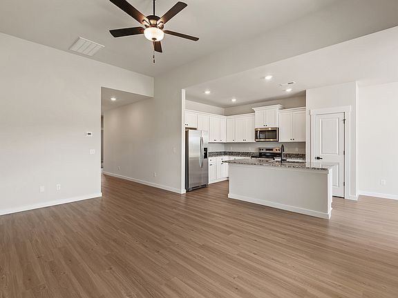 The kitchen opens to the living area