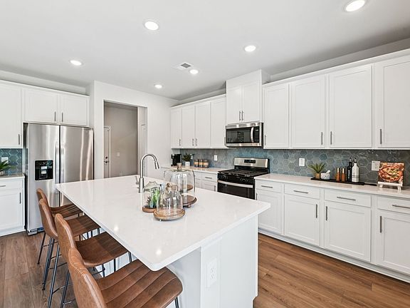 Kitchen in the Taylorsville floorplan at a Meritage Homes community in Mebane, NC.