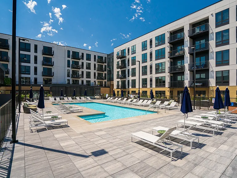 Soak up the sun poolside in a vibrant, modern community setting.