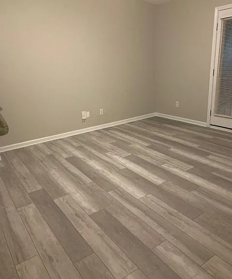 Brand new plank floors in master bedroom and threw out house.