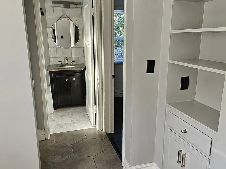 bathroom and bedroom entry view from dining room