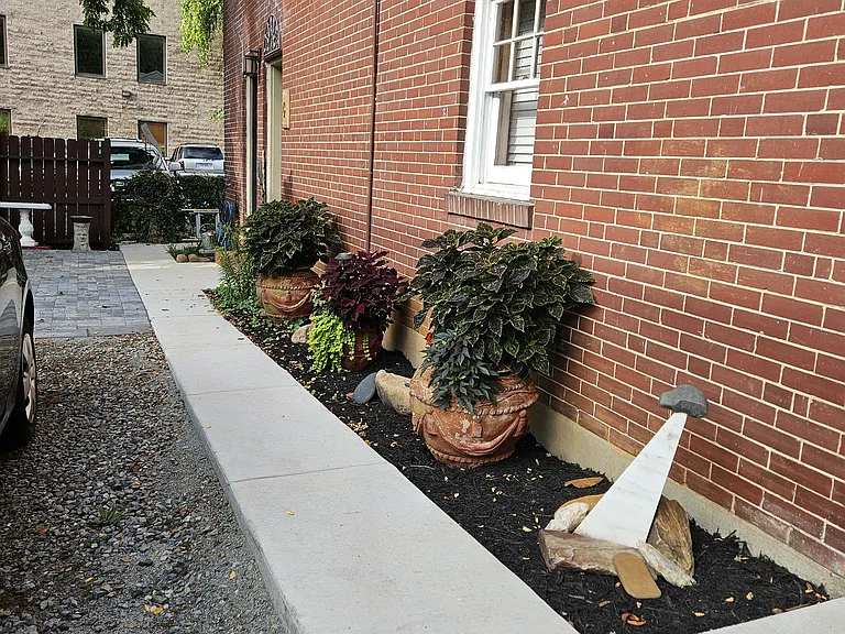 Walk way to laundry room behind the apartment.