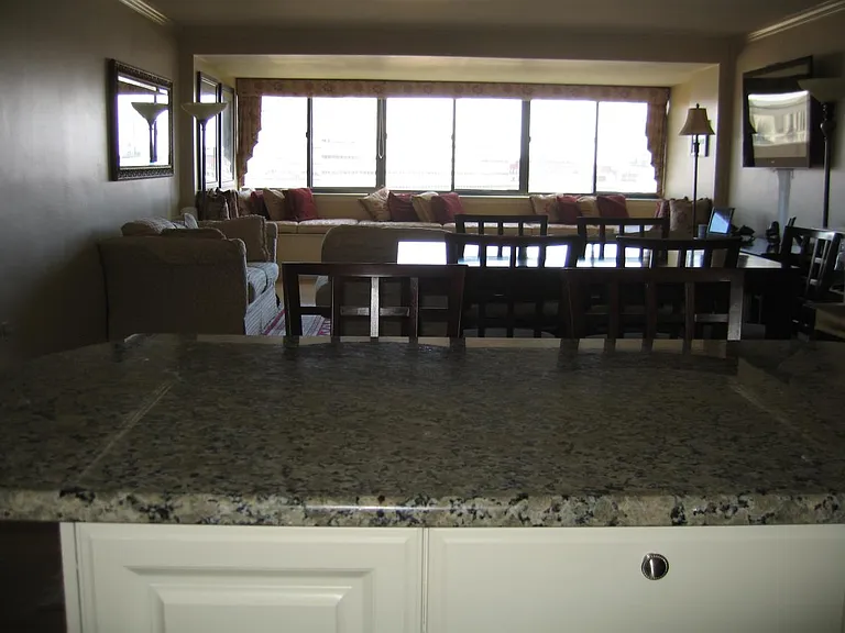 View from kitchen to enclosed balcony windows