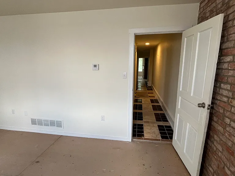 Front bedroom looking down hallway - carpet to be installed