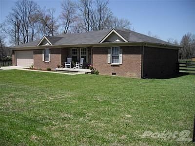 Cozy Country Setting...4 bedroom, 2.5 bath all brick home situated on a beautifully landscaped level