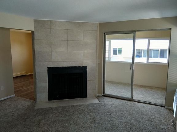 Custom tiled wood burning fireplace. The sun room adjacent to the family room.